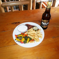 Fish and chips with veggies and Tartar sauce with a Nile special