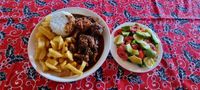 Sweet and Sour meatballs, rice,chips and fresh mixed salad